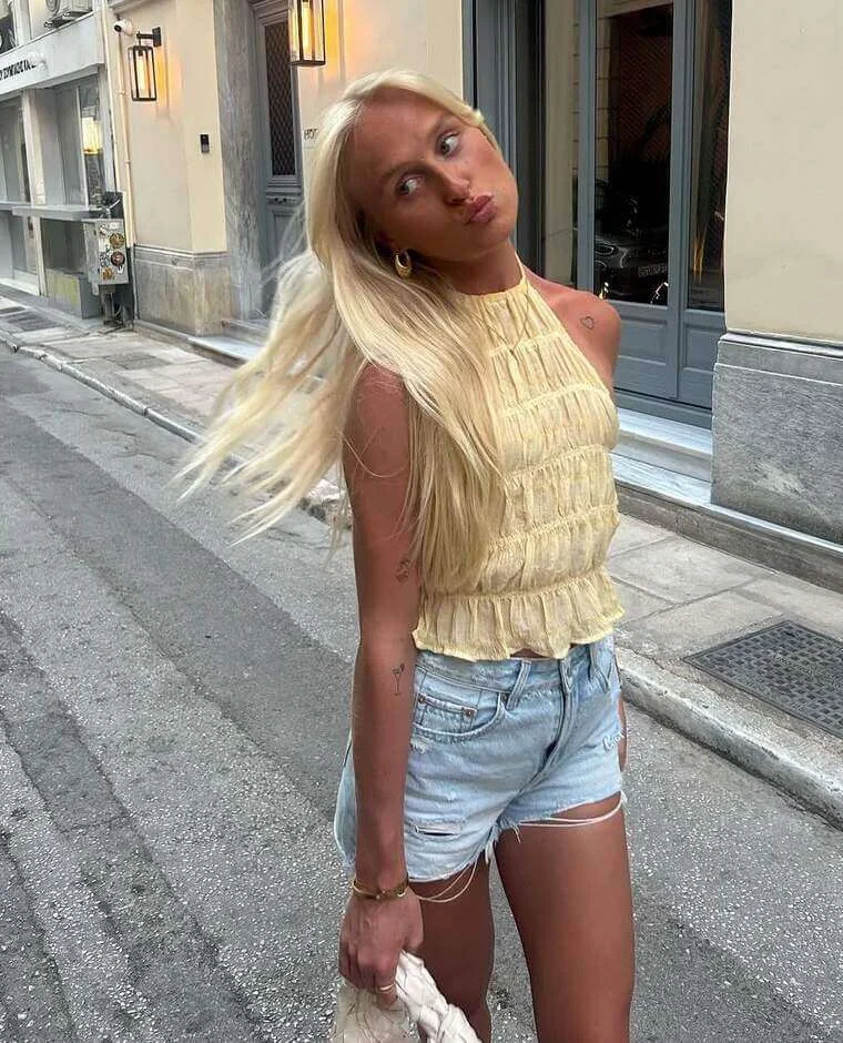 21. Yellow Top with Denim Shorts