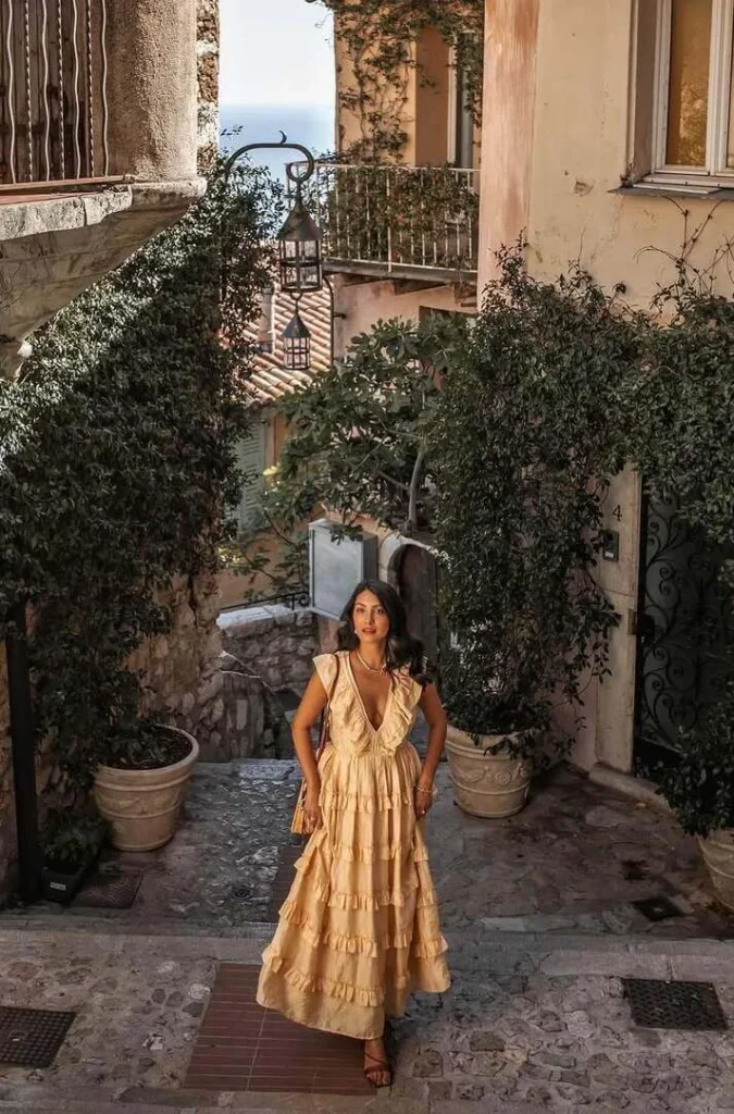 8. Tiered Beige Dress in a Stone Alley