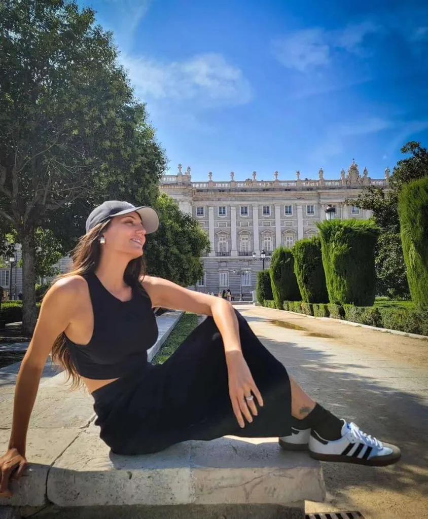 10. Black Cutout Dress with Sneakers and Cap