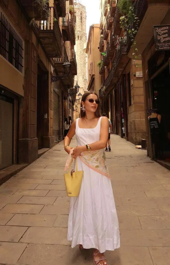 3. White Maxi Dress with Statement Accessories